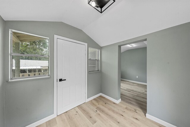 1813 Madera Dr, Waco, TX 76705 - hall featuring wood finished floors and vaulted ceiling