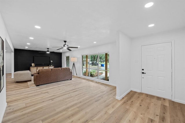 1813 Madera Dr, Waco, TX 76705 - unfurnished living room with recessed lighting, light wood-style flooring, ceiling fan, and a fireplace