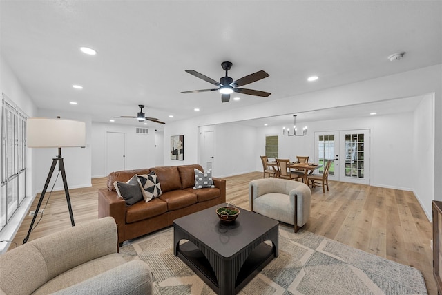 1813 Madera Dr, Waco, TX 76705 - living room with light wood-type flooring, recessed lighting, a ceiling fan, and a chandelier