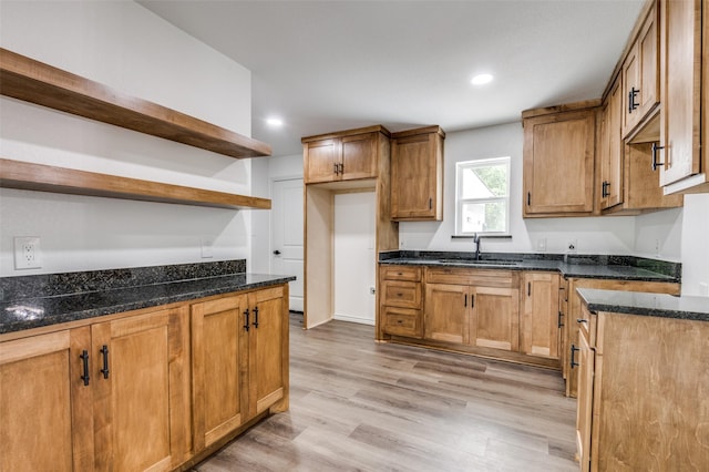 2775 E Overton Rd, Dallas, TX 75216 - kitchen with open shelves, dark stone countertops, light wood-type flooring, recessed lighting, and brown cabinetry