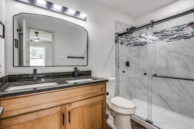 2775 E Overton Rd, Dallas, TX 75216 - bathroom with double vanity, a stall shower, and a ceiling fan