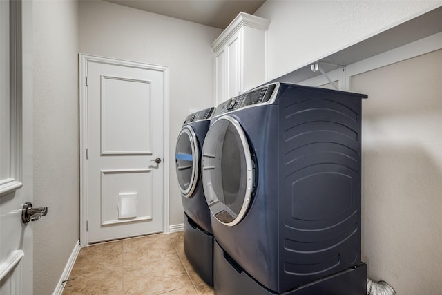 1909 Rocky Ct, Corinth, TX 76208 - laundry area with washing machine and clothes dryer and light tile patterned flooring
