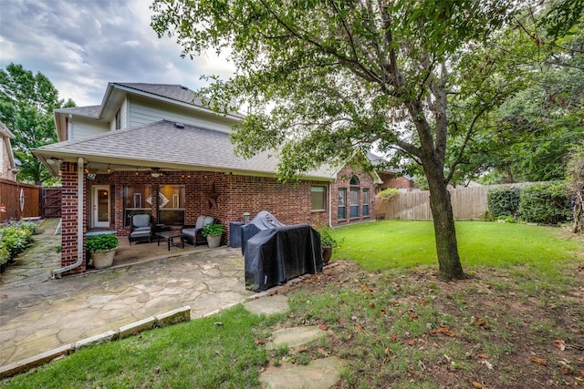 1909 Rocky Ct, Corinth, TX 76208 - fenced backyard featuring ceiling fan and a patio area