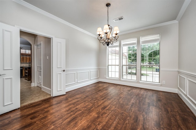 1909 Rocky Ct, Corinth, TX 76208 - empty room with ornamental molding, arched walkways, dark wood-style floors, a chandelier, and wainscoting