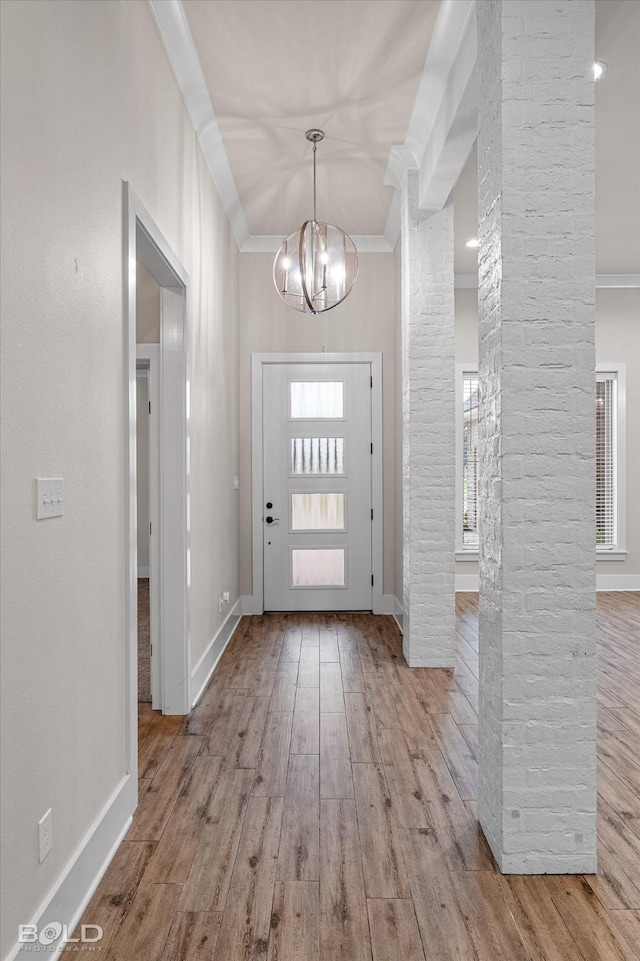140 St Andrews Ln, Benton, LA 71006 - entryway featuring crown molding, a chandelier, and wood finished floors