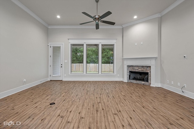 140 St Andrews Ln, Benton, LA 71006 - unfurnished living room with a ceiling fan, ornamental molding, wood finished floors, a stone fireplace, and recessed lighting