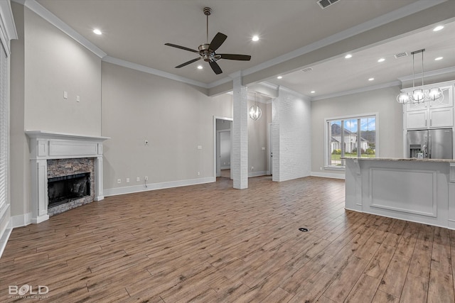 140 St Andrews Ln, Benton, LA 71006 - unfurnished living room featuring ornamental molding, ceiling fan, light wood-style floors, a fireplace, and recessed lighting