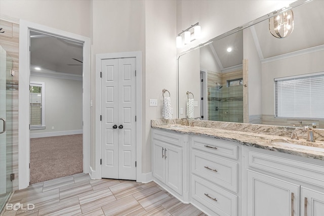140 St Andrews Ln, Benton, LA 71006 - bathroom with a shower stall, double vanity, lofted ceiling, and crown molding