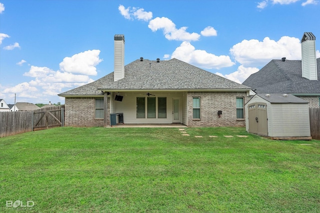 140 St Andrews Ln, Benton, LA 71006 - rear view of property featuring brick siding, a storage unit, a fenced backyard, a patio, and ceiling fan
