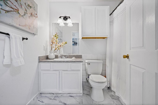 1011 Reed Rd, Denton, TX 76205 - bathroom with vanity, marble finish floors, and a shower with curtain