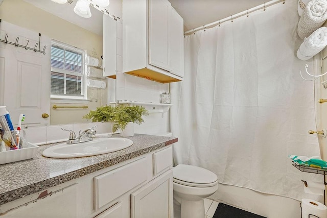 1011 Reed Rd, Denton, TX 76205 - full bathroom featuring vanity and shower / bathtub combination with curtain