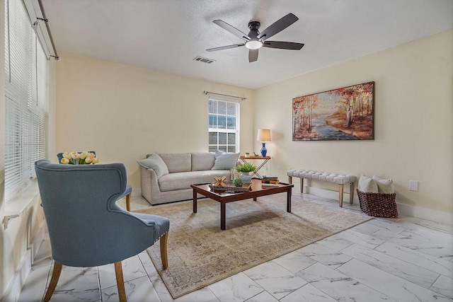 1011 Reed Rd, Denton, TX 76205 - living room with marble look tile flooring and a ceiling fan