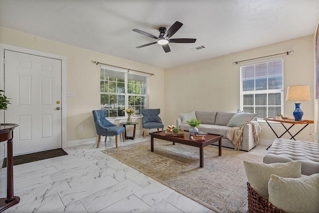 1011 Reed Rd, Denton, TX 76205 - living area featuring marble look tile flooring and ceiling fan