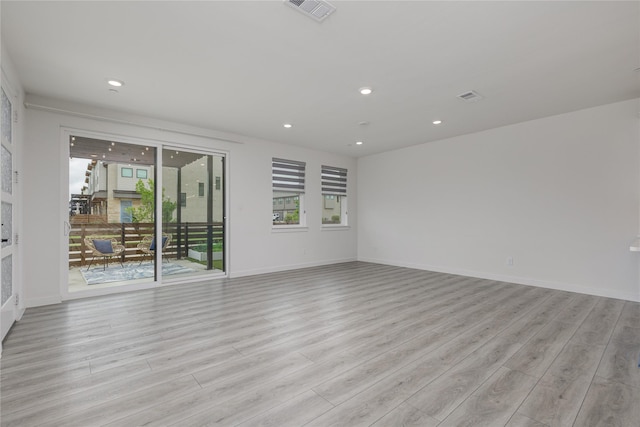 3811 Pine Leaf Ln, Prosper, TX 75078 - empty room featuring light wood-type flooring and recessed lighting