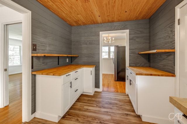 733 N Willis St, Abilene, TX 79603 - kitchen featuring wood counters, open shelves, wood ceiling, freestanding refrigerator, and a chandelier