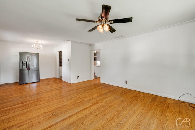 733 N Willis St, Abilene, TX 79603 - spare room with a chandelier, ceiling fan, light wood finished floors, and crown molding