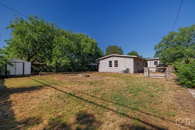 733 N Willis St, Abilene, TX 79603 - view of yard featuring a shed and an outdoor fire pit