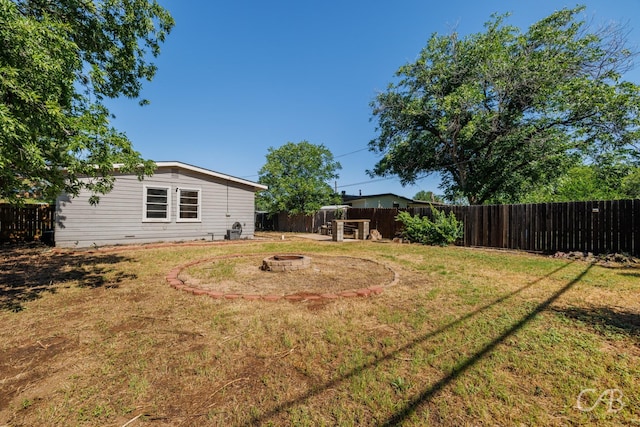 733 N Willis St, Abilene, TX 79603 - fenced backyard featuring a fire pit