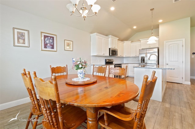 7362 Connor Rd, Abilene, TX 79602 - dining room with a chandelier, lofted ceiling, light wood finished floors, and recessed lighting