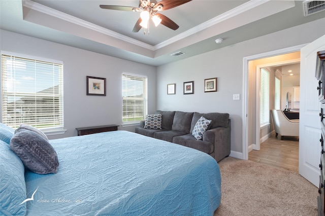7362 Connor Rd, Abilene, TX 79602 - bedroom with crown molding, a raised ceiling, light carpet, and ceiling fan