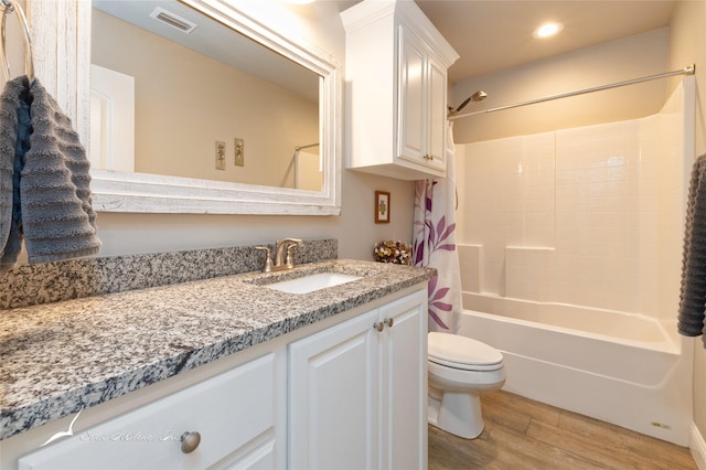 7362 Connor Rd, Abilene, TX 79602 - full bathroom featuring vanity, wood finished floors, shower / bath combination with curtain, and recessed lighting
