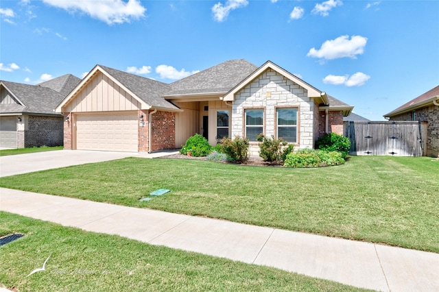 7362 Connor Rd, Abilene, TX 79602 - ranch-style house with a garage, driveway, board and batten siding, a gate, and brick siding