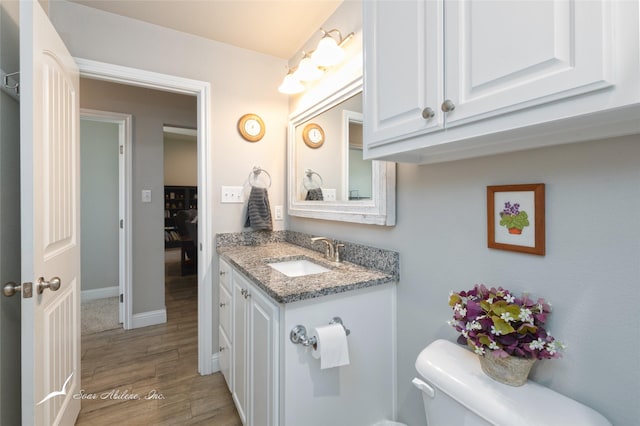 7362 Connor Rd, Abilene, TX 79602 - half bathroom featuring wood finished floors and vanity