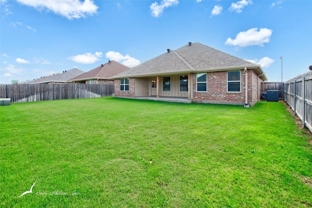 7362 Connor Rd, Abilene, TX 79602 - back of house with a fenced backyard, brick siding, and a shingled roof