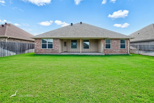 7362 Connor Rd, Abilene, TX 79602 - rear view of property with a patio area, a fenced backyard, brick siding, and roof with shingles