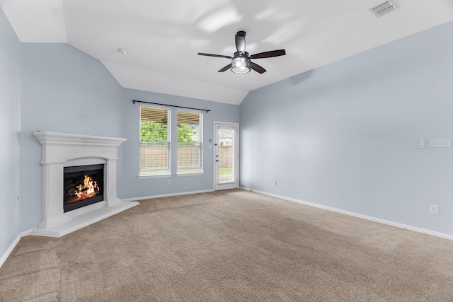 10305 Matador Dr, Mckinney, TX 75072 - unfurnished living room with lofted ceiling, a ceiling fan, a lit fireplace, and carpet flooring