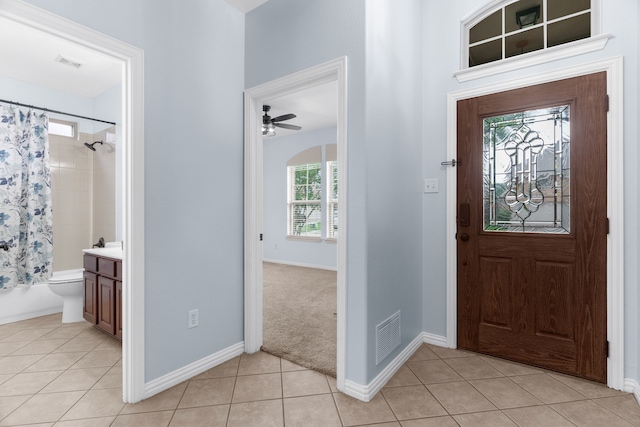 10305 Matador Dr, Mckinney, TX 75072 - entryway with light tile patterned floors and a ceiling fan