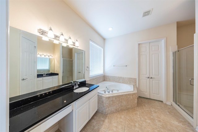 220 Justin Rd, Murphy, TX 75094 - full bathroom featuring a bath, vanity, a stall shower, and tile patterned floors