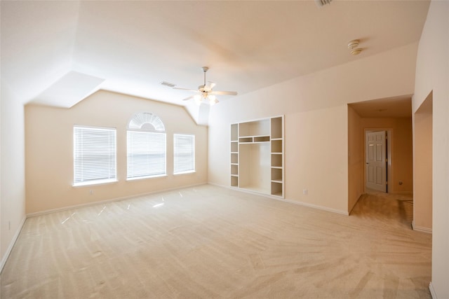 220 Justin Rd, Murphy, TX 75094 - spare room with light carpet, ceiling fan, lofted ceiling, and built in shelves