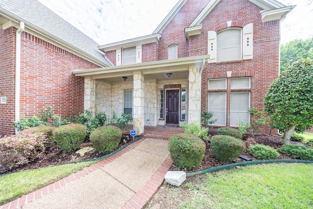 220 Justin Rd, Murphy, TX 75094 - entrance to property with brick siding, stone siding, and a shingled roof