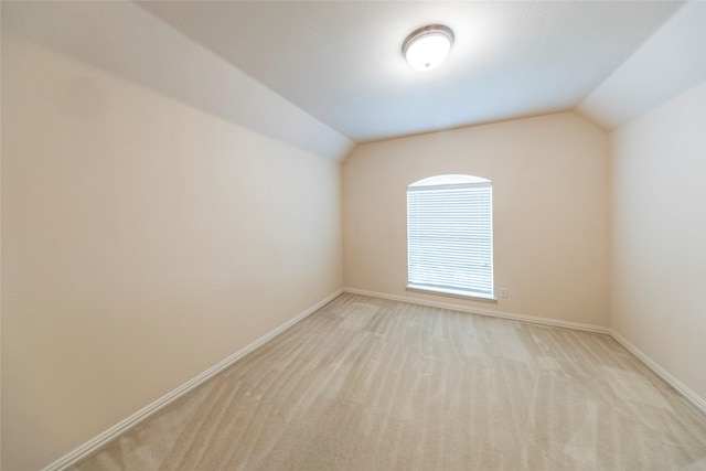 220 Justin Rd, Murphy, TX 75094 - unfurnished room with vaulted ceiling and light colored carpet