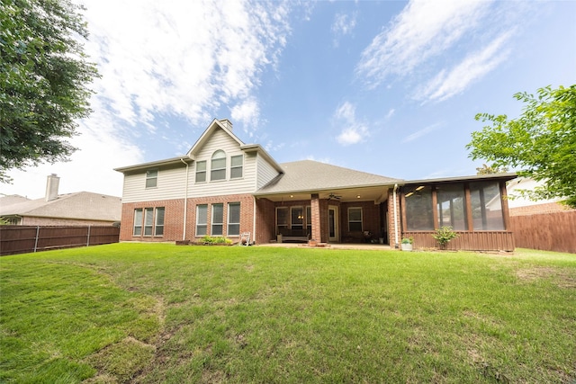 220 Justin Rd, Murphy, TX 75094 - rear view of property featuring a sunroom, brick siding, ceiling fan, a fenced backyard, and a chimney