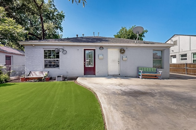 3832 Mount Ranier St, Dallas, TX 75211 - view of front of property featuring a patio area, brick siding, and a shingled roof