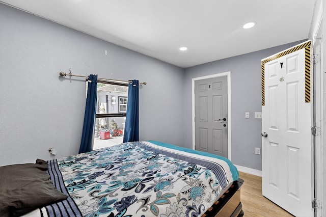 3832 Mount Ranier St, Dallas, TX 75211 - bedroom featuring light wood-type flooring and recessed lighting