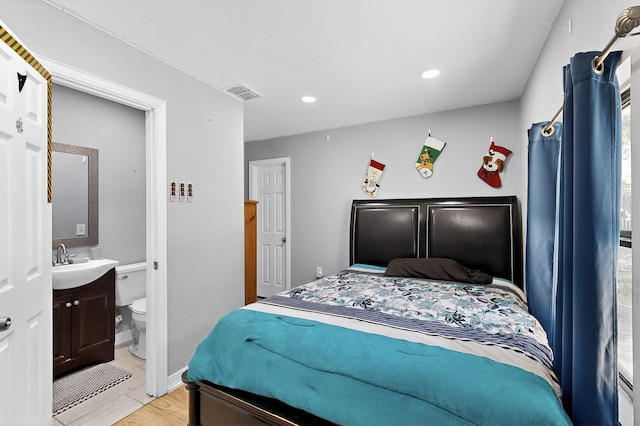 3832 Mount Ranier St, Dallas, TX 75211 - bedroom with light wood finished floors and recessed lighting