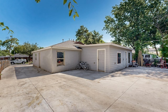 3832 Mount Ranier St, Dallas, TX 75211 - view of front of home with a patio area and a shingled roof