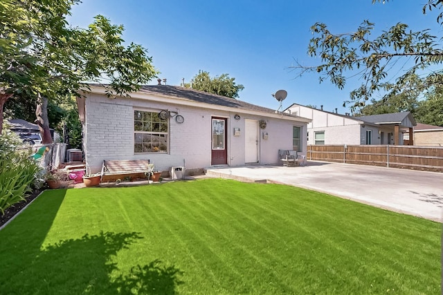 3832 Mount Ranier St, Dallas, TX 75211 - back of property featuring a patio and brick siding