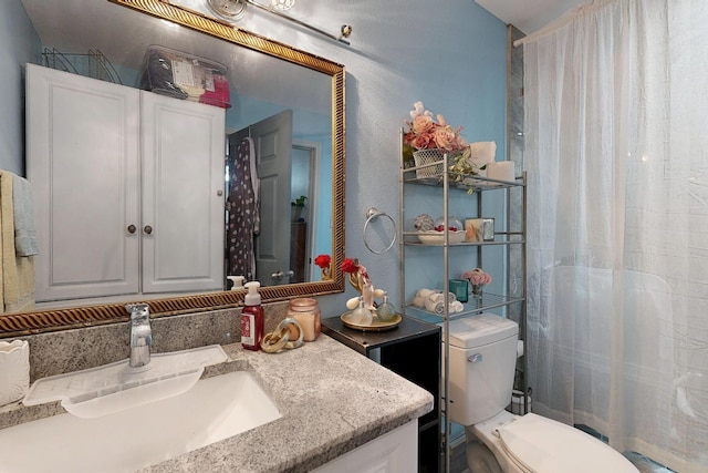 3832 Mount Ranier St, Dallas, TX 75211 - full bathroom featuring vanity, a textured wall, and a shower with curtain