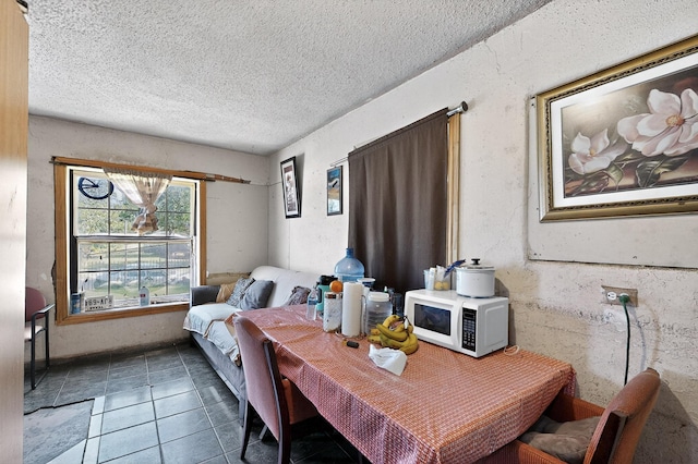 3832 Mount Ranier St, Dallas, TX 75211 - dining area featuring a textured ceiling and tile patterned flooring