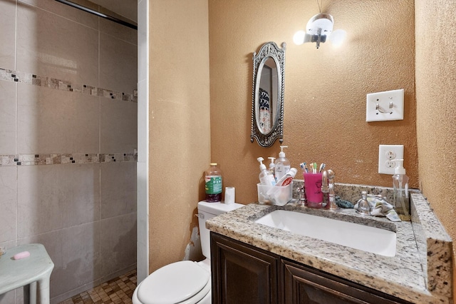 3832 Mount Ranier St, Dallas, TX 75211 - full bathroom with vanity, a tile shower, and a textured wall