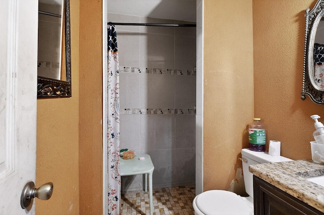 3832 Mount Ranier St, Dallas, TX 75211 - full bath with a tile shower, vanity, a textured wall, and tile patterned floors