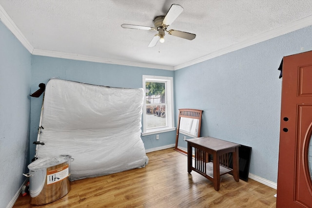 3832 Mount Ranier St, Dallas, TX 75211 - bedroom with ornamental molding, light wood-type flooring, a textured ceiling, and ceiling fan