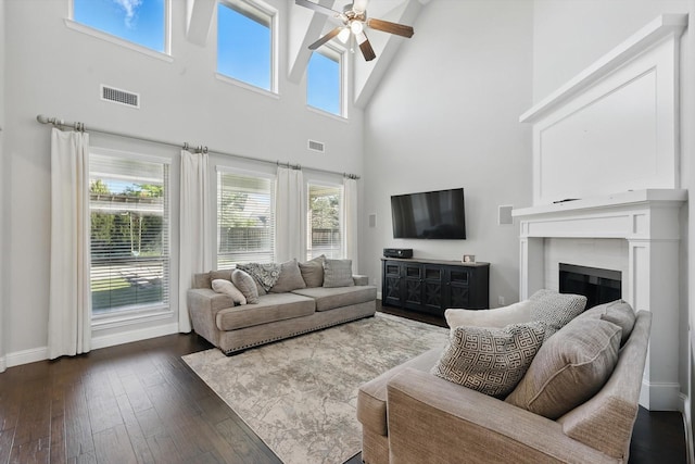 1617 Commons Way, Prosper, TX 75078 - living room featuring high vaulted ceiling, a ceiling fan, dark wood-type flooring, and a fireplace
