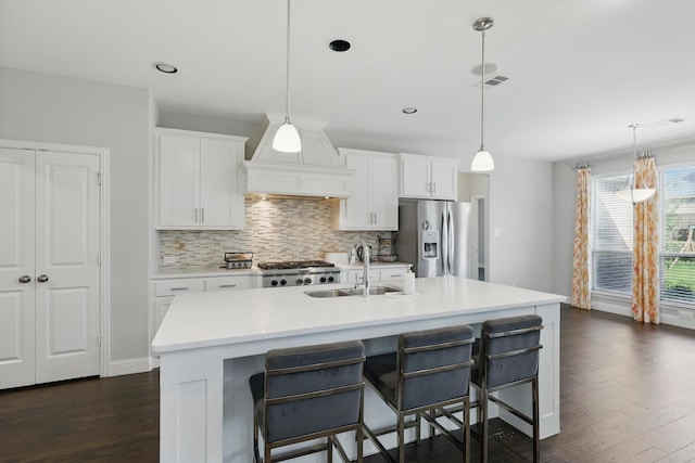 1617 Commons Way, Prosper, TX 75078 - kitchen with stainless steel refrigerator with ice dispenser, premium range hood, dark wood finished floors, decorative backsplash, and light countertops