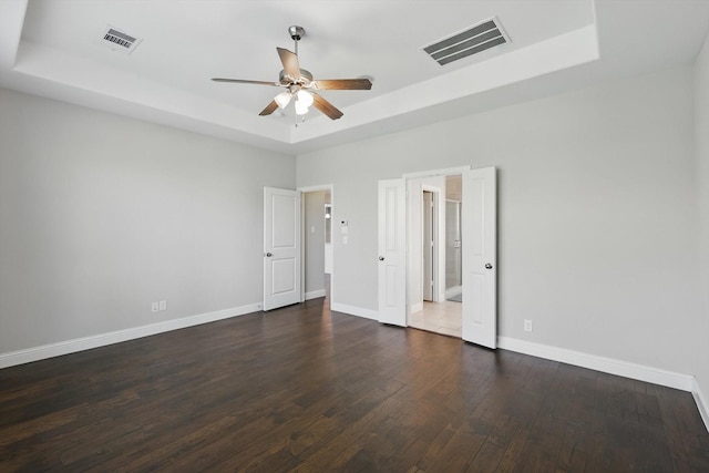 1617 Commons Way, Prosper, TX 75078 - unfurnished bedroom featuring a raised ceiling, wood finished floors, and ceiling fan