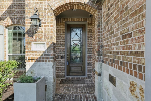 1617 Commons Way, Prosper, TX 75078 - doorway to property with brick siding